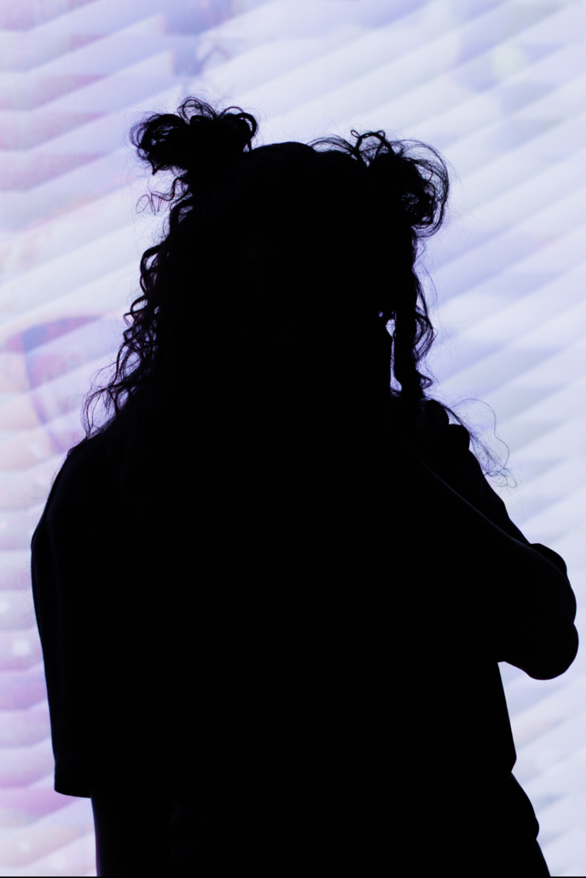 Woman in styled editorial wardrobe, night city setting