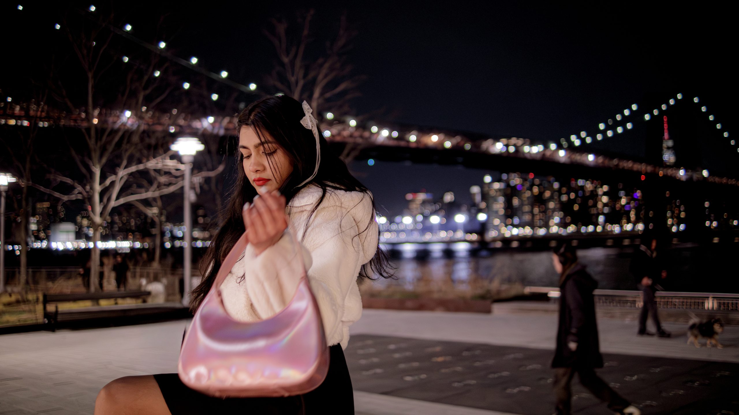 Candid portrait in a neon-lit night city setting